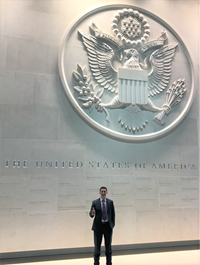 man standing in front of US Capital Seal